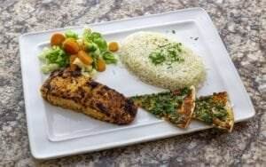A plate with rice, chicken and vegetables, a delicious and healthy meal in Dearborn.