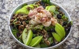 A Mediterranean seafood salad with shrimp, apples and walnuts.